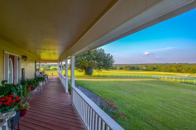 a kitchen with sink refrigerator and cabinets