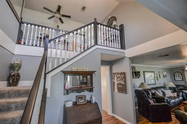 a bedroom with two beds and a large window