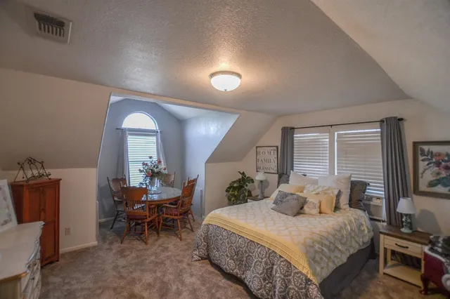 a view of a big house with a swimming pool