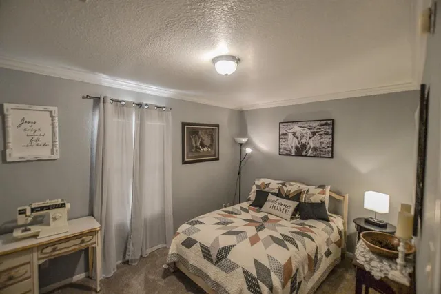 a view of a studio with wooden floor