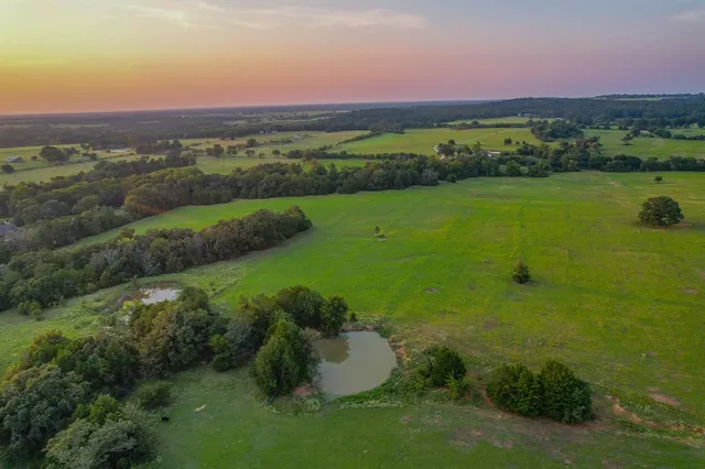 a view of a golf course with a lake