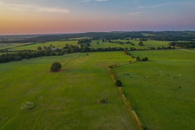a view of a golf course with a golf course with the ocean view