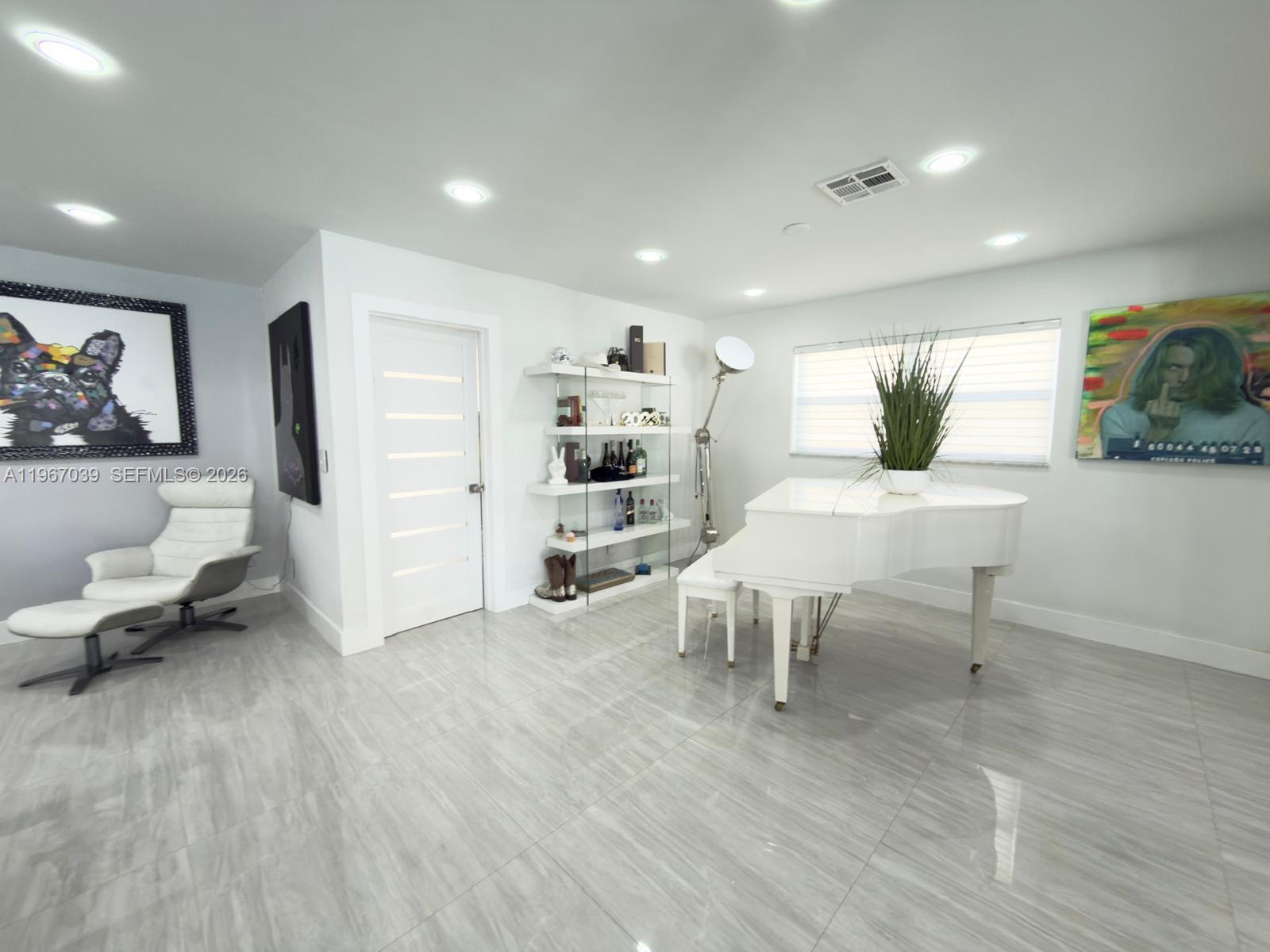 4801 West Park Road Hollywood, FL 33021 - Photo 11 of 30 a living room with furniture and a wooden floor