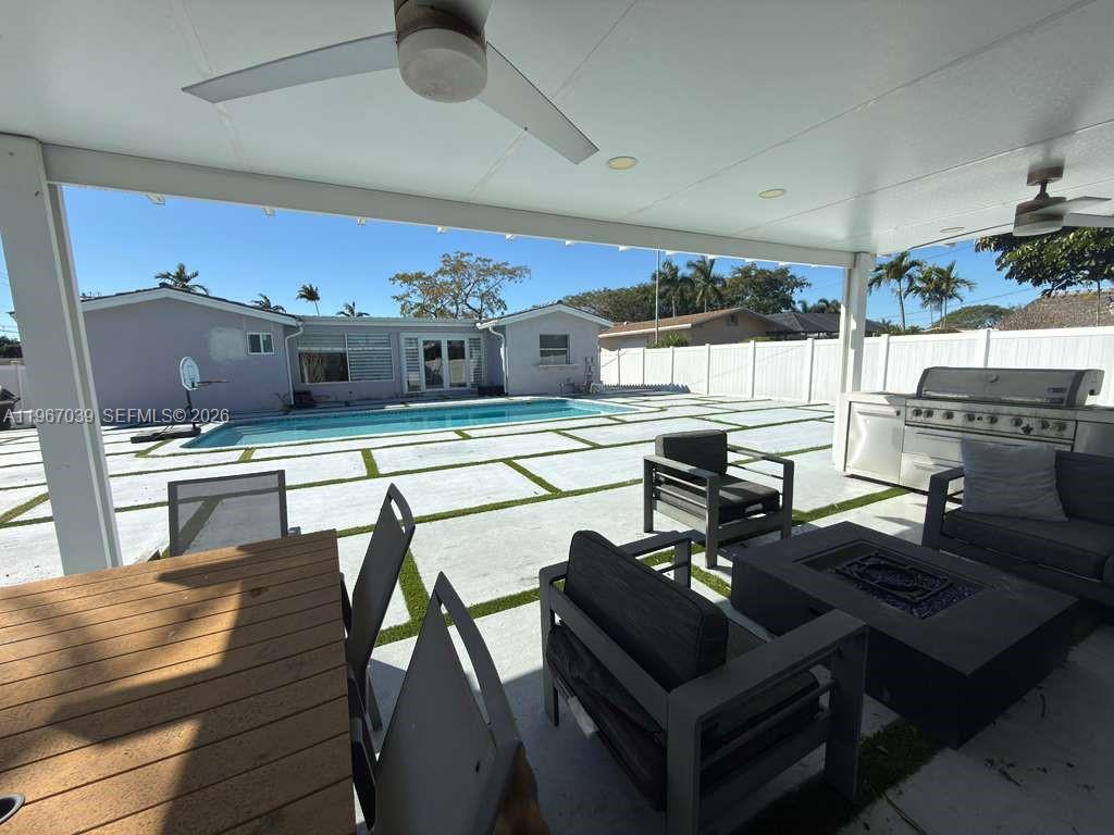 4801 West Park Road Hollywood, FL 33021 - Photo 23 of 30 a living room with stainless steel appliances kitchen island granite countertop furniture and a kitchen view