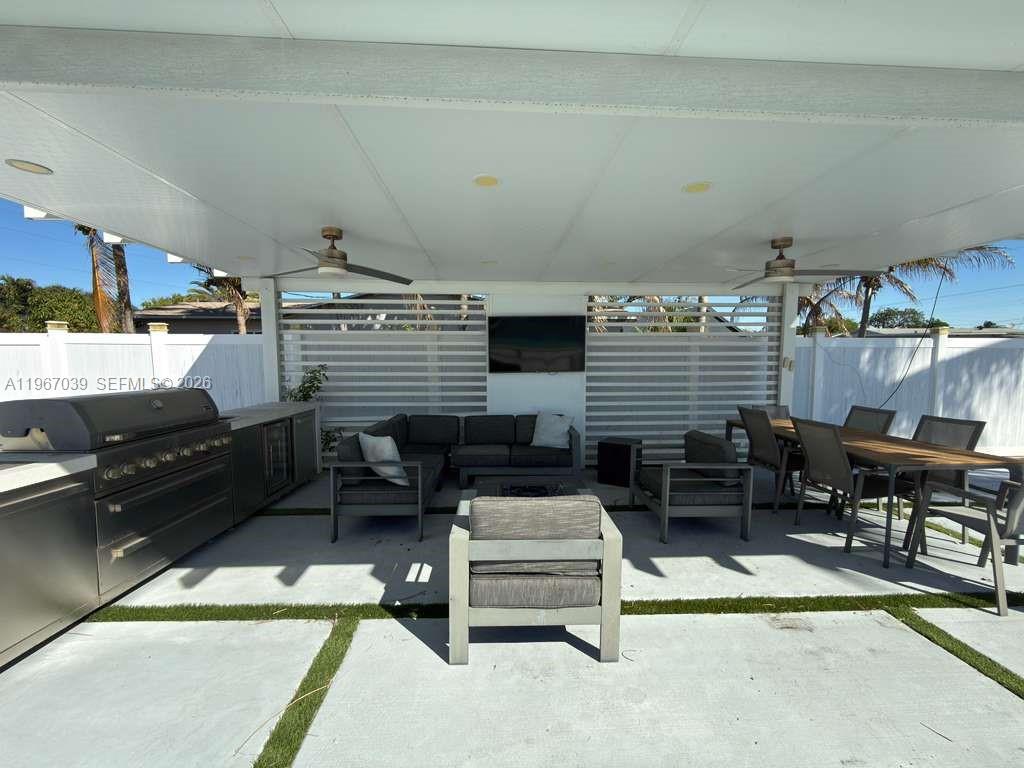 4801 West Park Road Hollywood, FL 33021 - Photo 26 of 30 a reading room with furniture and a fireplace