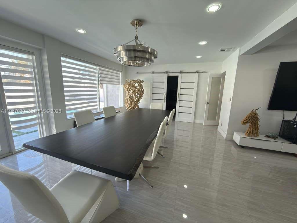 4801 West Park Road Hollywood, FL 33021 - Photo 7 of 30 a view of a living room and dining room