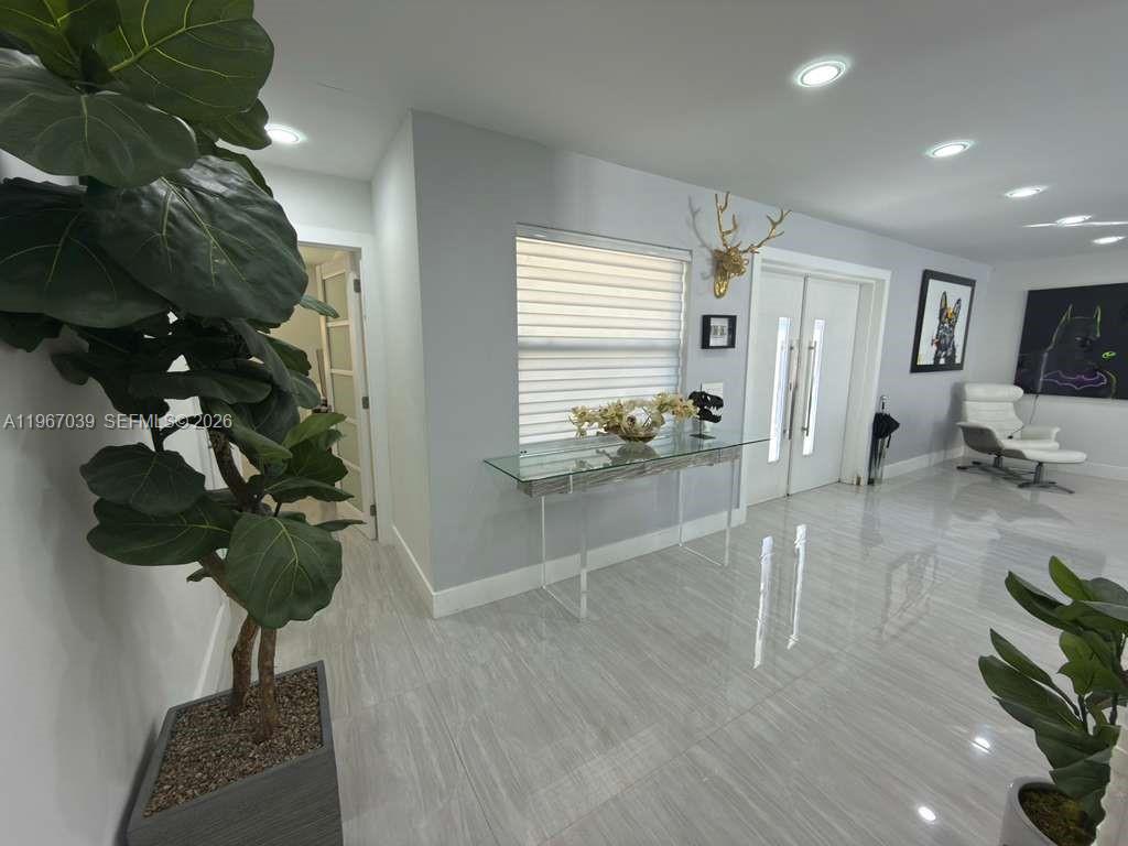 4801 West Park Road Hollywood, FL 33021 - Photo 10 of 30 a view of living room with furniture and a potted plant