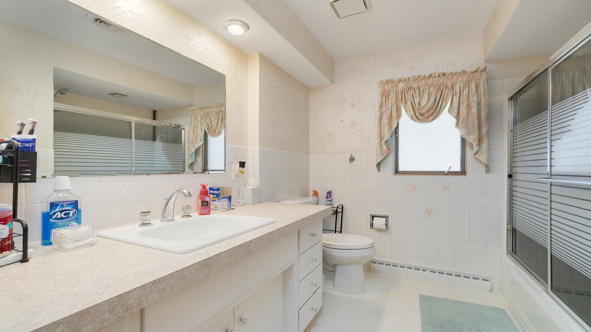 809 North Alpine Road Rockford, IL 61107 - Photo 14 of 48 a bathroom with a sink and a mirror