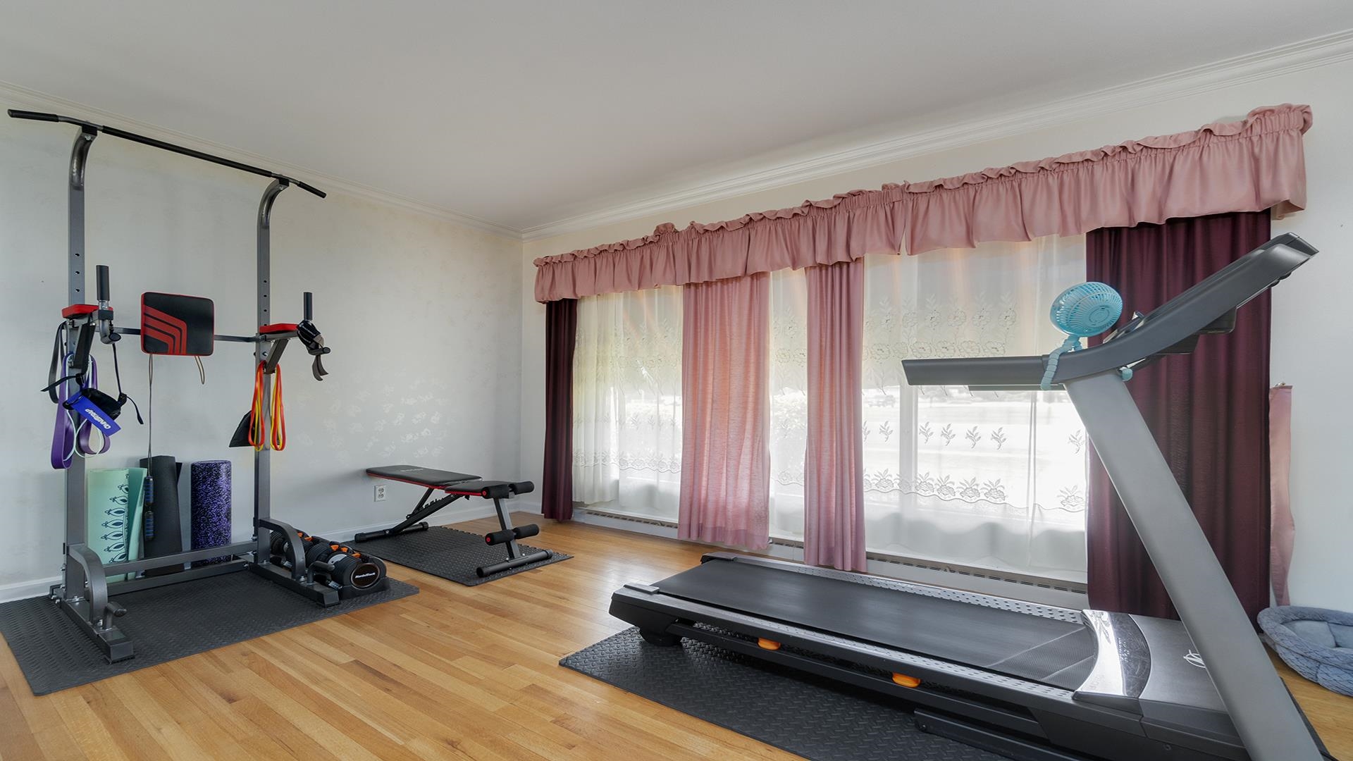 809 North Alpine Road Rockford, IL 61107 - Photo 3 of 48 a room with gym equipment and a window