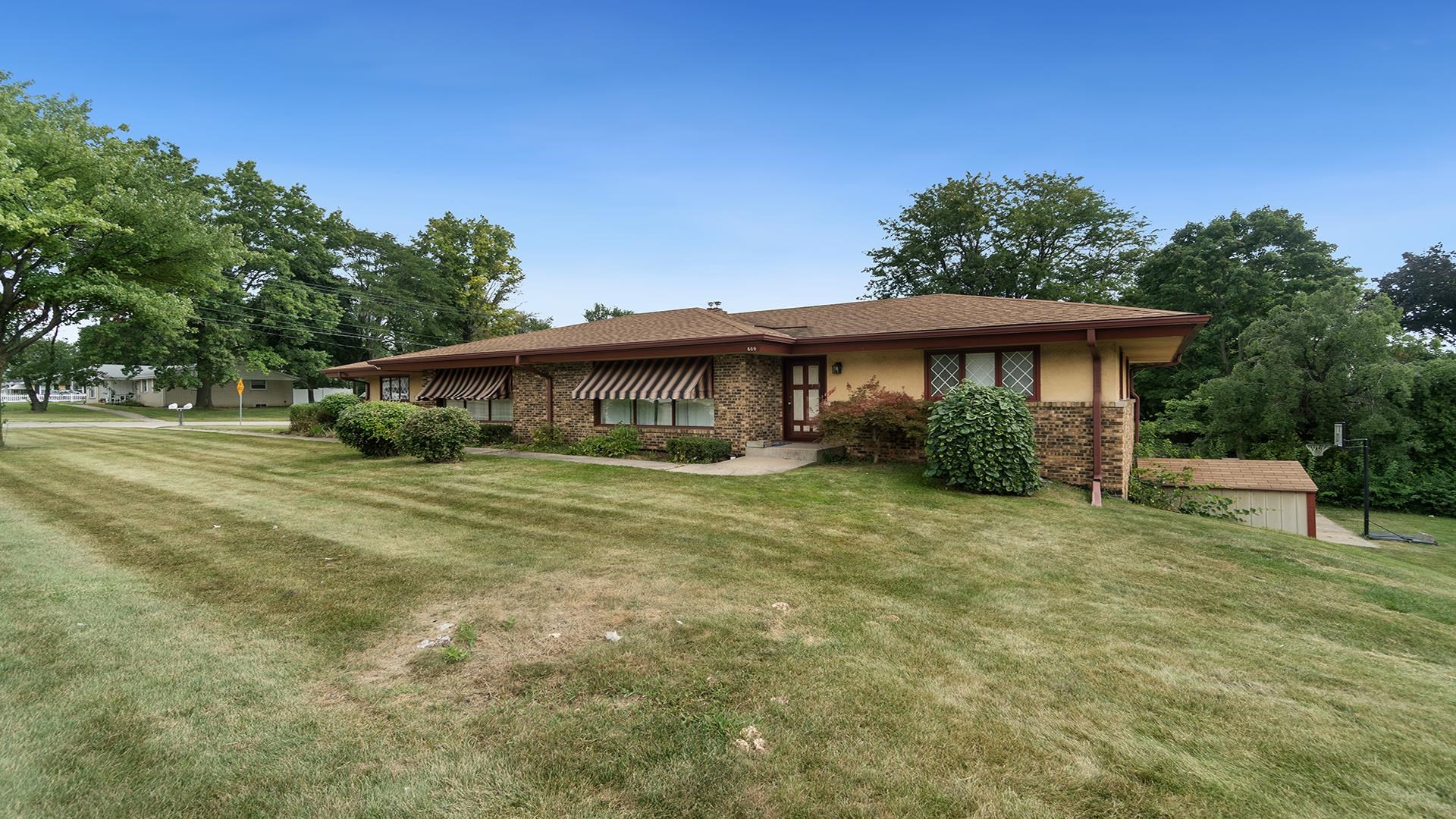 809 North Alpine Road Rockford, IL 61107 - Photo 32 of 48 a front view of a house with a garden
