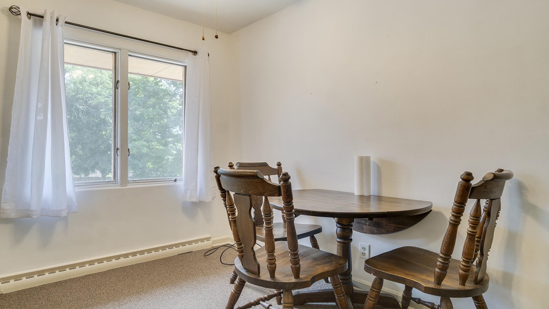 809 North Alpine Road Rockford, IL 61107 - Photo 42 of 48 a view of a dining room with furniture and a window
