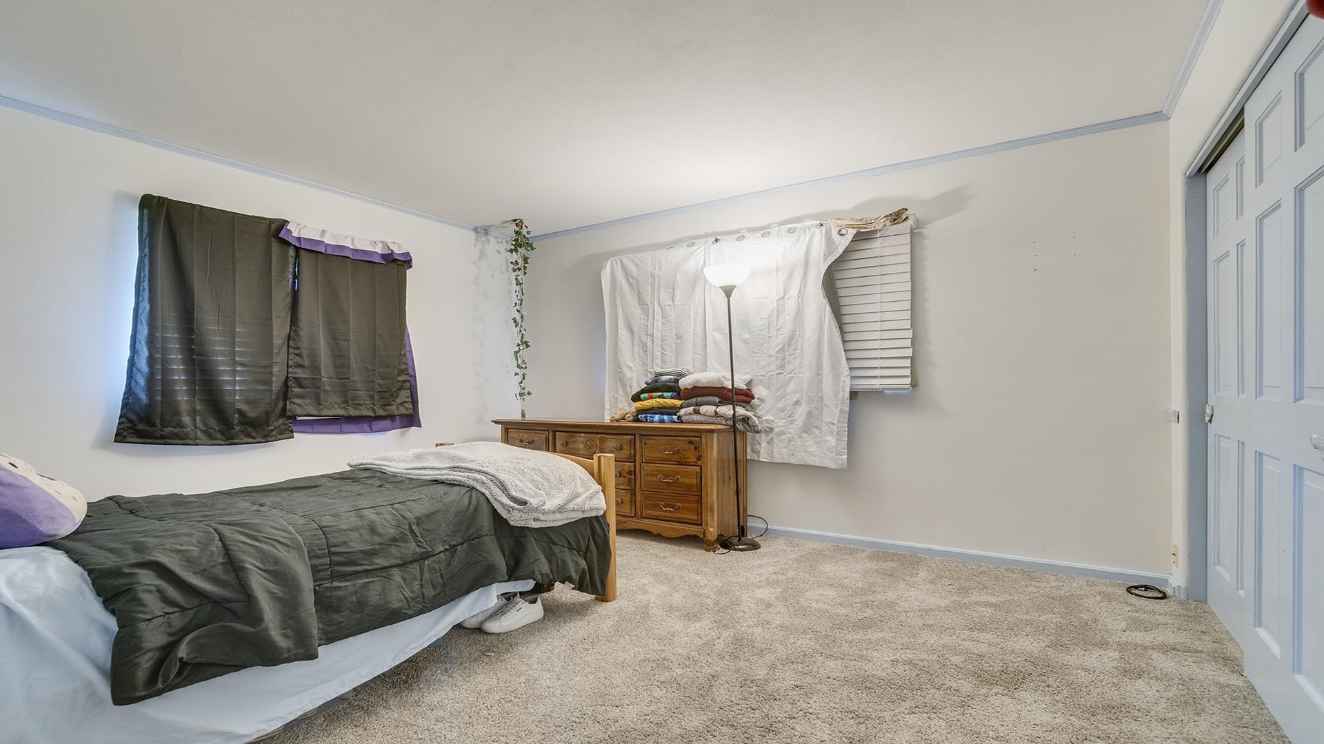 809 North Alpine Road Rockford, IL 61107 - Photo 44 of 48 a bedroom with a bed and a dresser