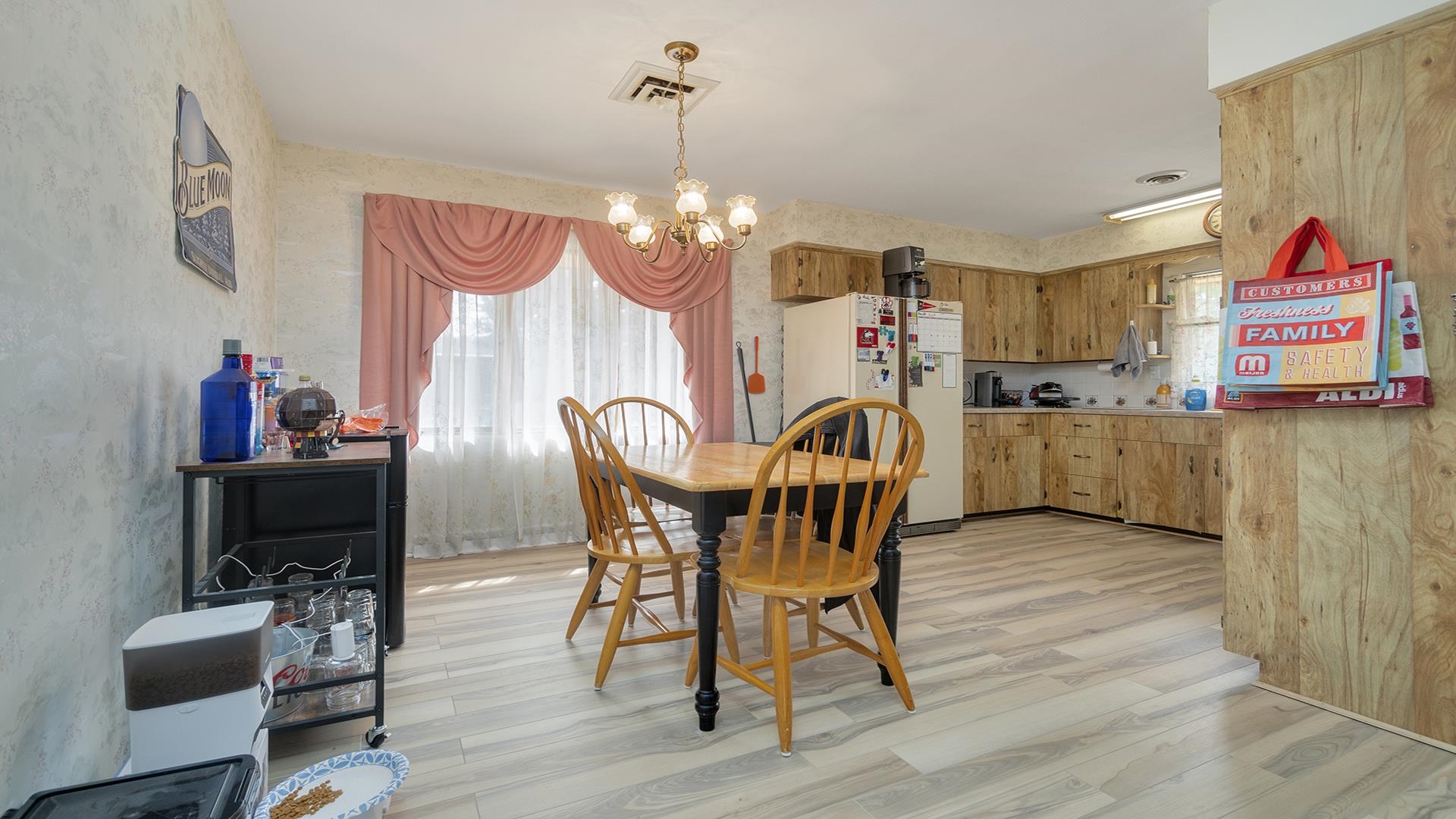 809 North Alpine Road Rockford, IL 61107 - Photo 7 of 48 a view of a dining room with furniture and chandelier