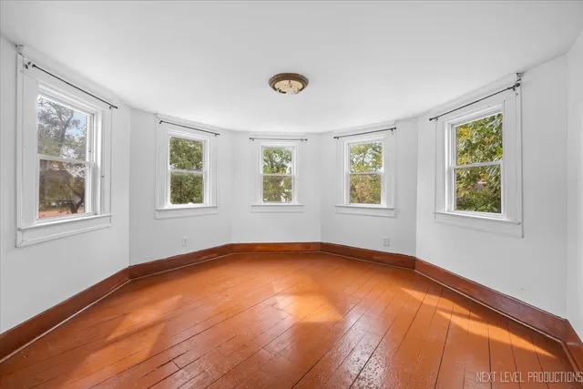 a view of an empty room with windows