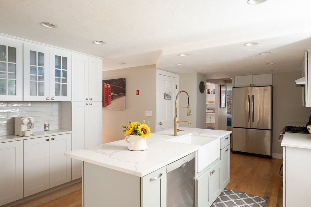 79 North Street Hanover, MA 02339 - Photo 11 of 42 a kitchen with a sink appliances and cabinets
