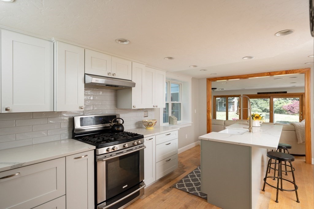 79 North Street Hanover, MA 02339 - Photo 13 of 42 a kitchen that has a sink and a stove in it