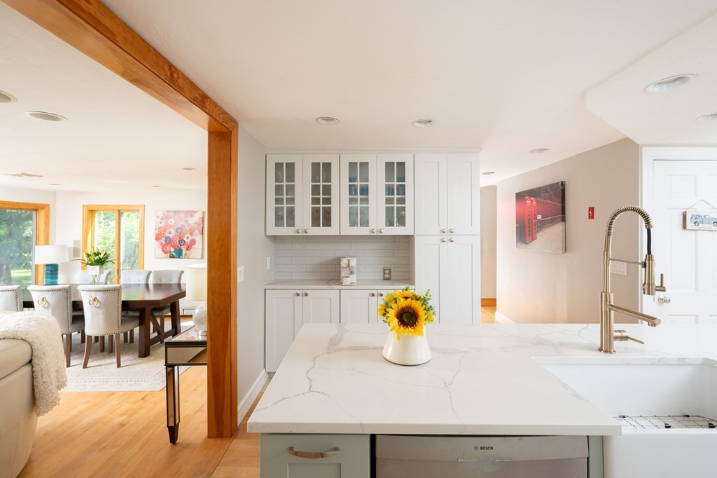 79 North Street Hanover, MA 02339 - Photo 14 of 42 a kitchen with a sink dining table and chairs