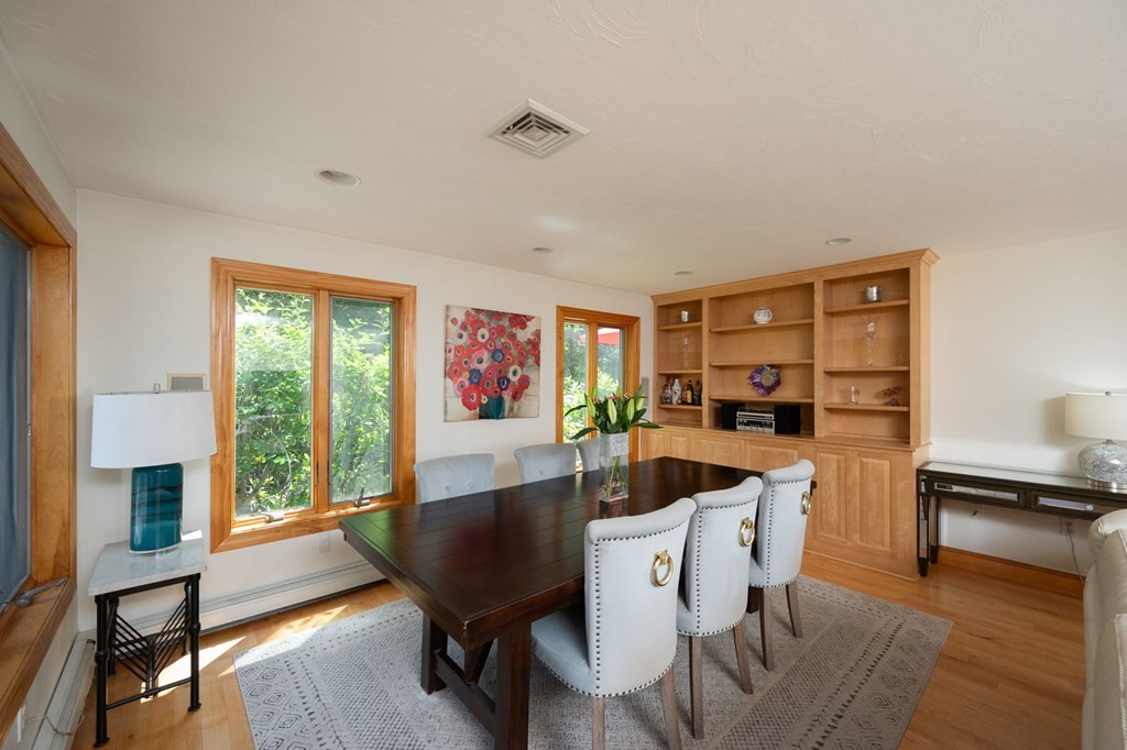 79 North Street Hanover, MA 02339 - Photo 16 of 42 a dining room with furniture a window and wooden floor