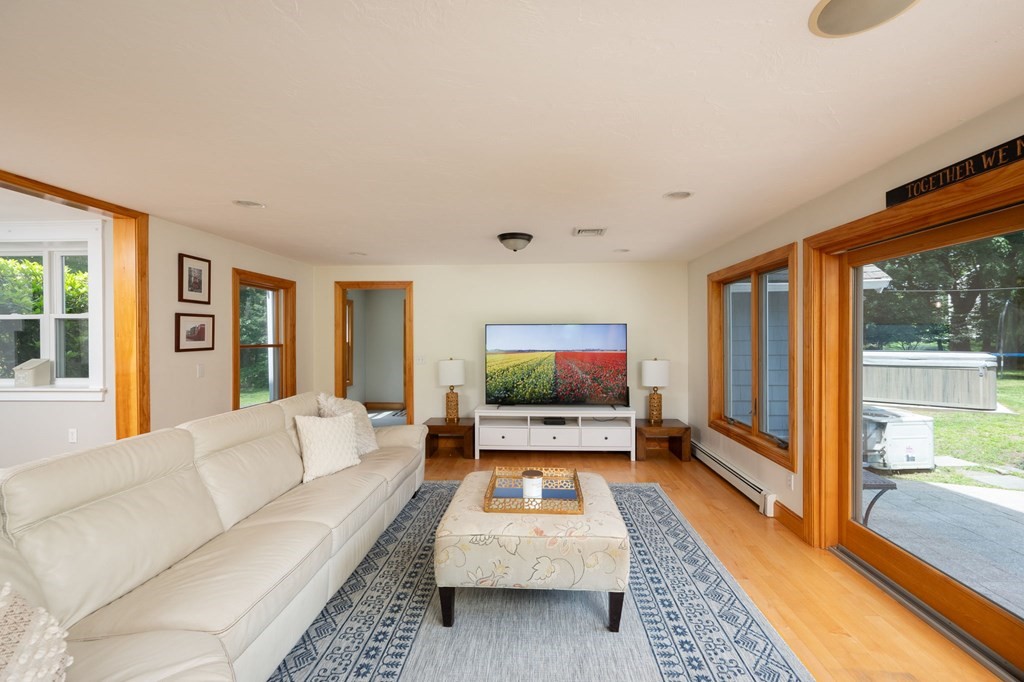 79 North Street Hanover, MA 02339 - Photo 17 of 42 a living room with furniture and a flat screen tv