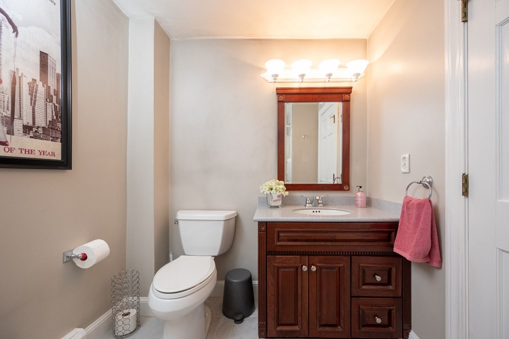 79 North Street Hanover, MA 02339 - Photo 18 of 42 a bathroom with a sink a toilet and mirror