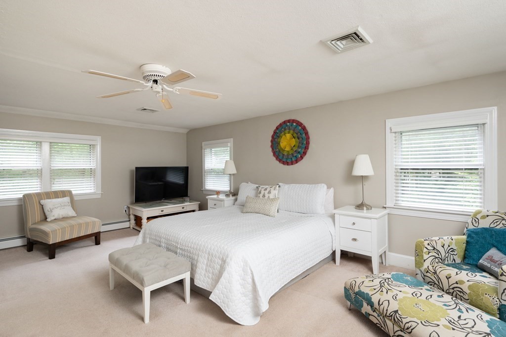79 North Street Hanover, MA 02339 - Photo 20 of 42 a bedroom with a bed and a couch