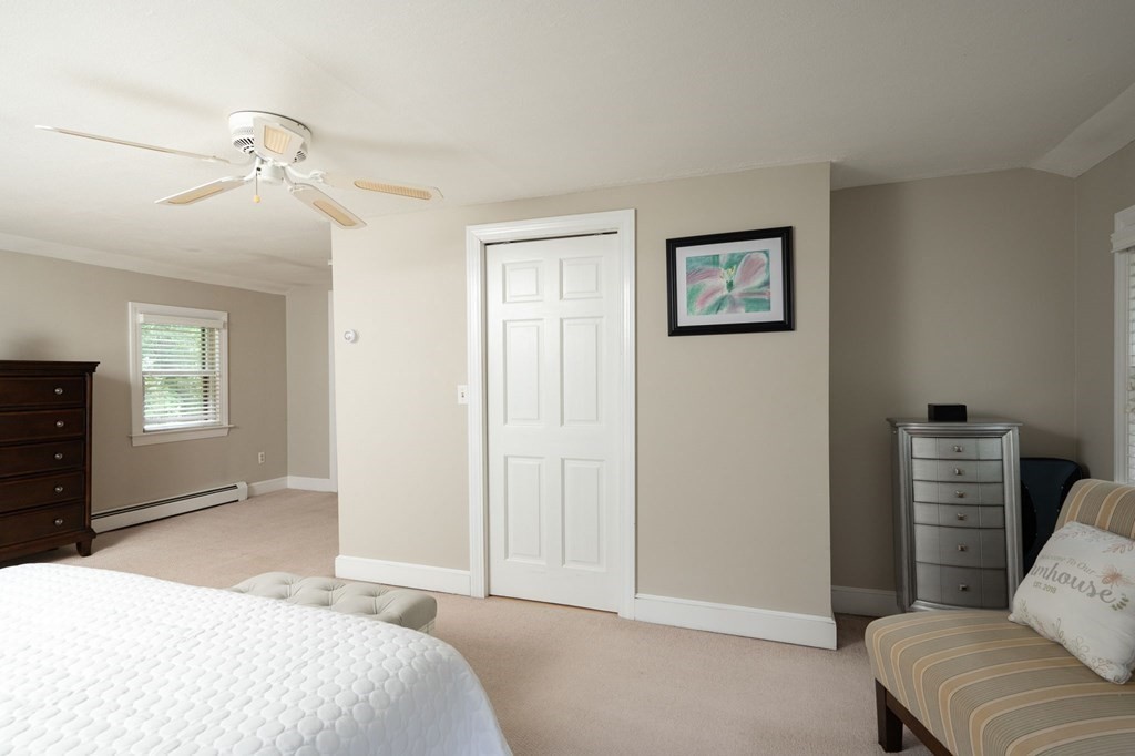 79 North Street Hanover, MA 02339 - Photo 21 of 42 a bedroom with a bed and a couch