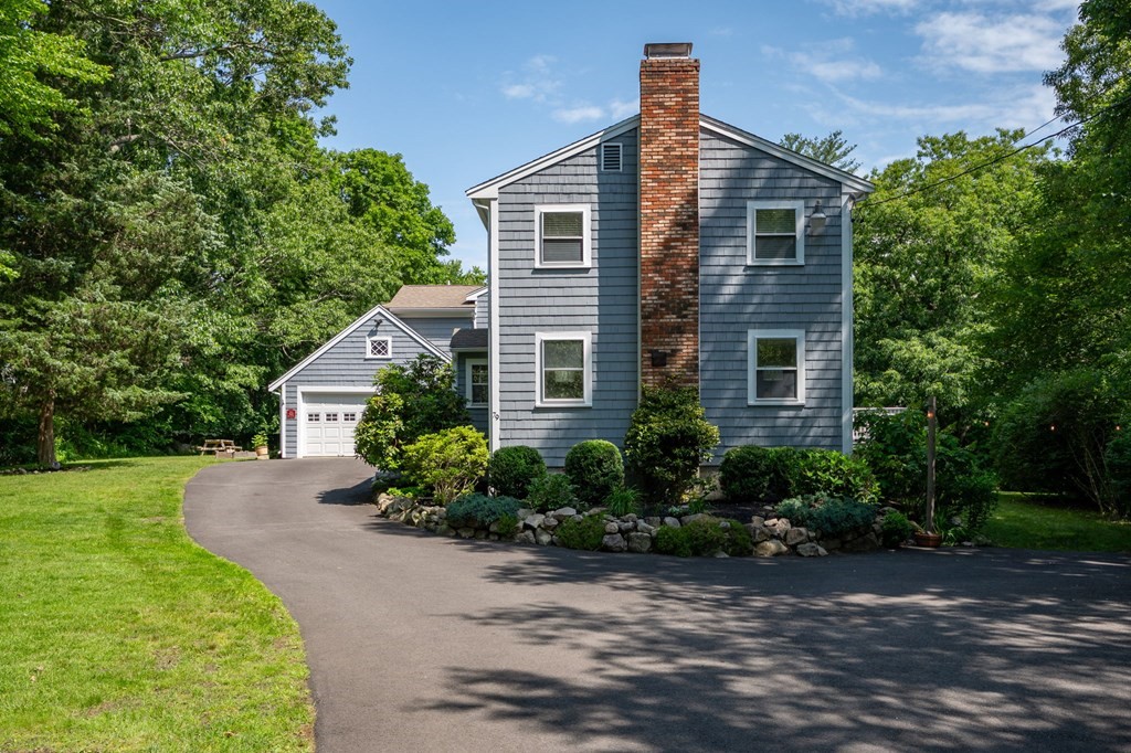 79 North Street Hanover, MA 02339 - Photo 3 of 42 a front view of a house with a yard