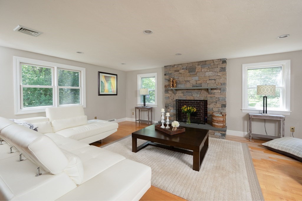 79 North Street Hanover, MA 02339 - Photo 4 of 42 a living room with furniture and a fireplace