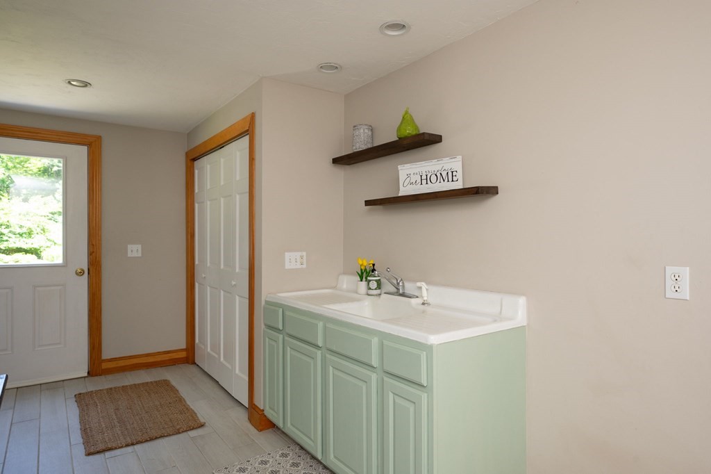 79 North Street Hanover, MA 02339 - Photo 7 of 42 a bathroom with a sink mirror and vanity