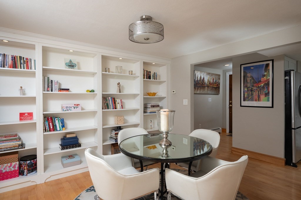 79 North Street Hanover, MA 02339 - Photo 9 of 42 a view of a dining room with furniture and a book shelf