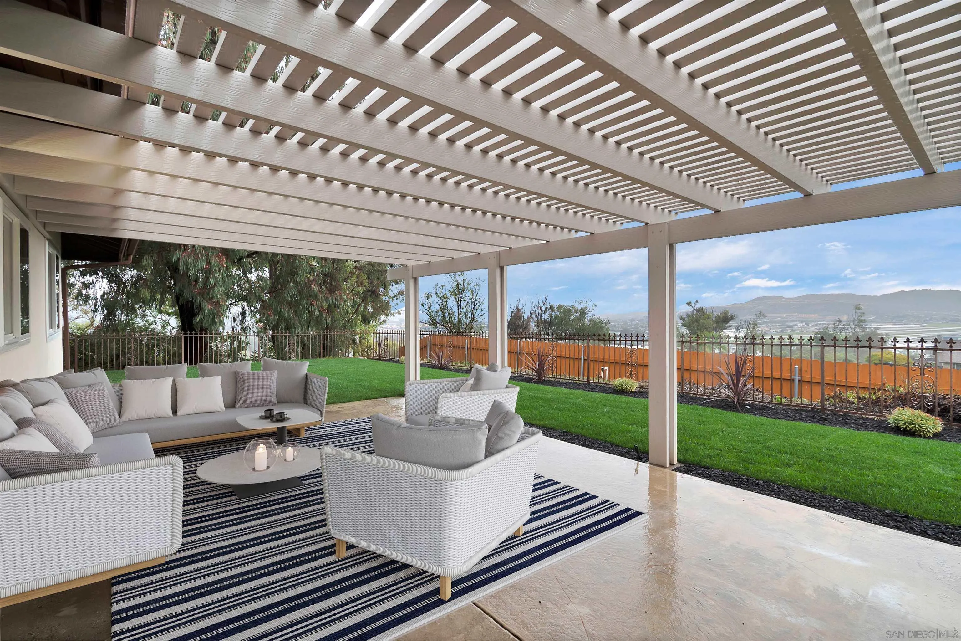 2796 Windmill View Road El Cajon, CA 92020 - Photo 1 of 14 a view of a patio with couches chairs and a big yard
