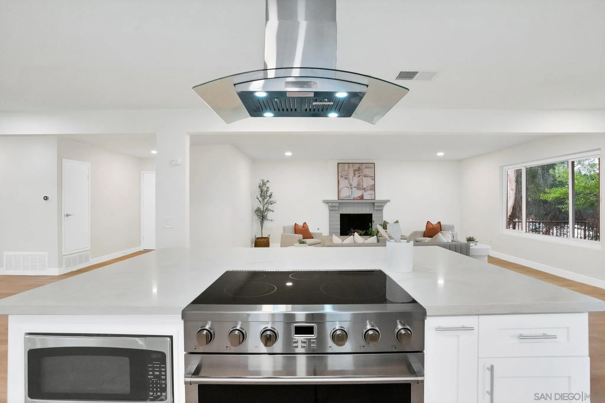 2796 Windmill View Road El Cajon, CA 92020 - Photo 3 of 14 a stove top oven sitting inside of a kitchen