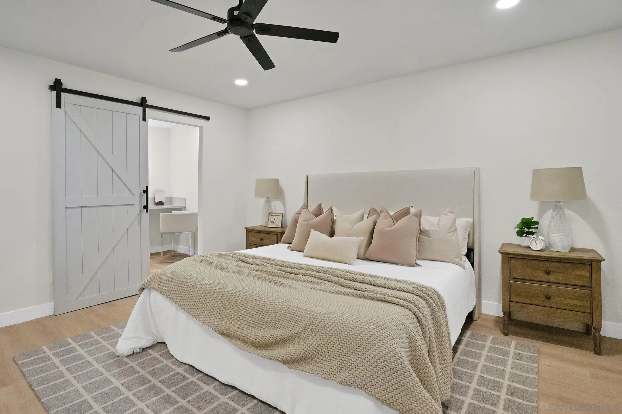 2796 Windmill View Road El Cajon, CA 92020 - Photo 7 of 14 a bedroom with a bed and a cabinets