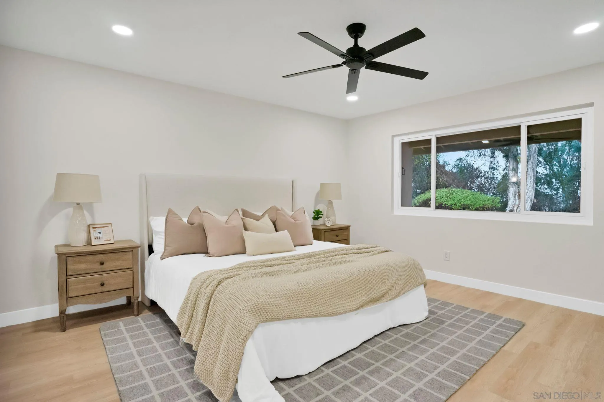 2796 Windmill View Road El Cajon, CA 92020 - Photo 8 of 14 a bedroom with bed and a window
