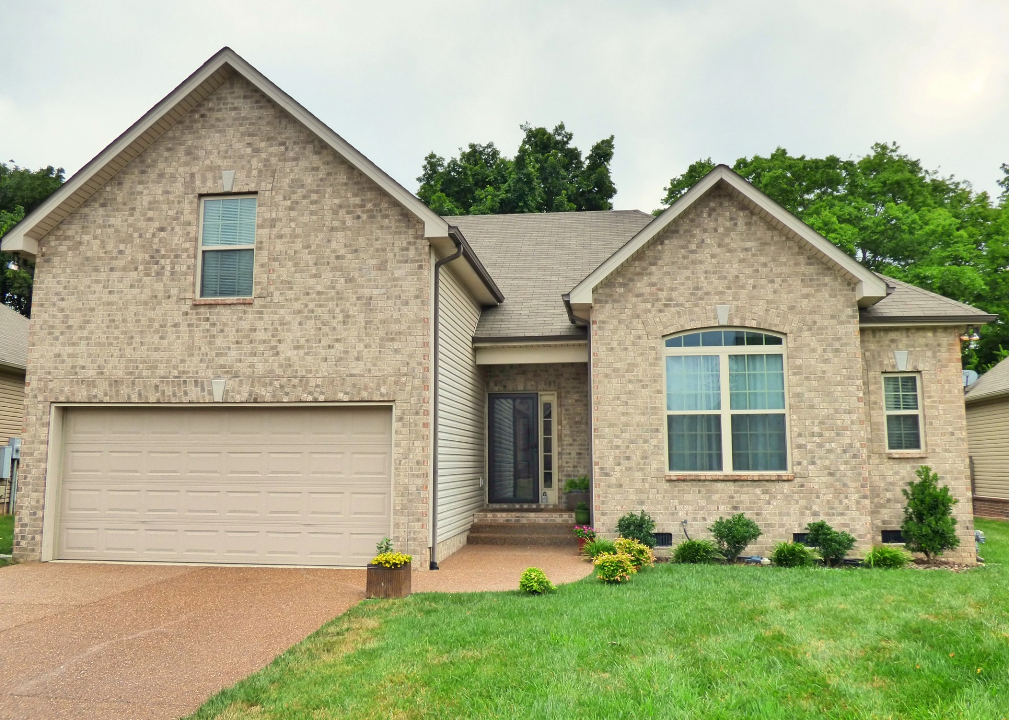 1076 Golf View Way Spring Hill, TN 37174 - Photo 2 of 19 a view of front of a house with a yard
