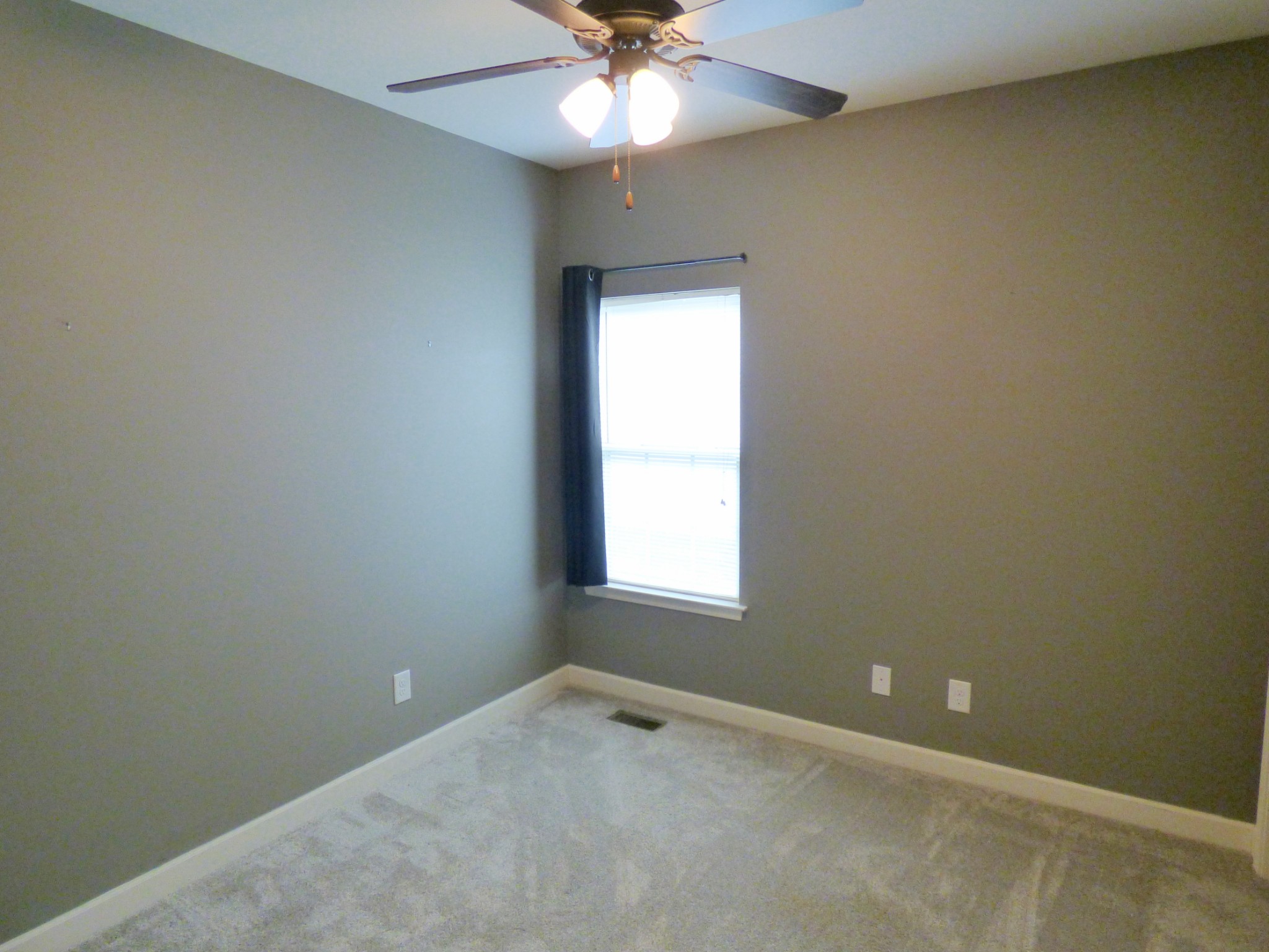 1076 Golf View Way Spring Hill, TN 37174 - Photo 13 of 19 an empty room with a window and a fan