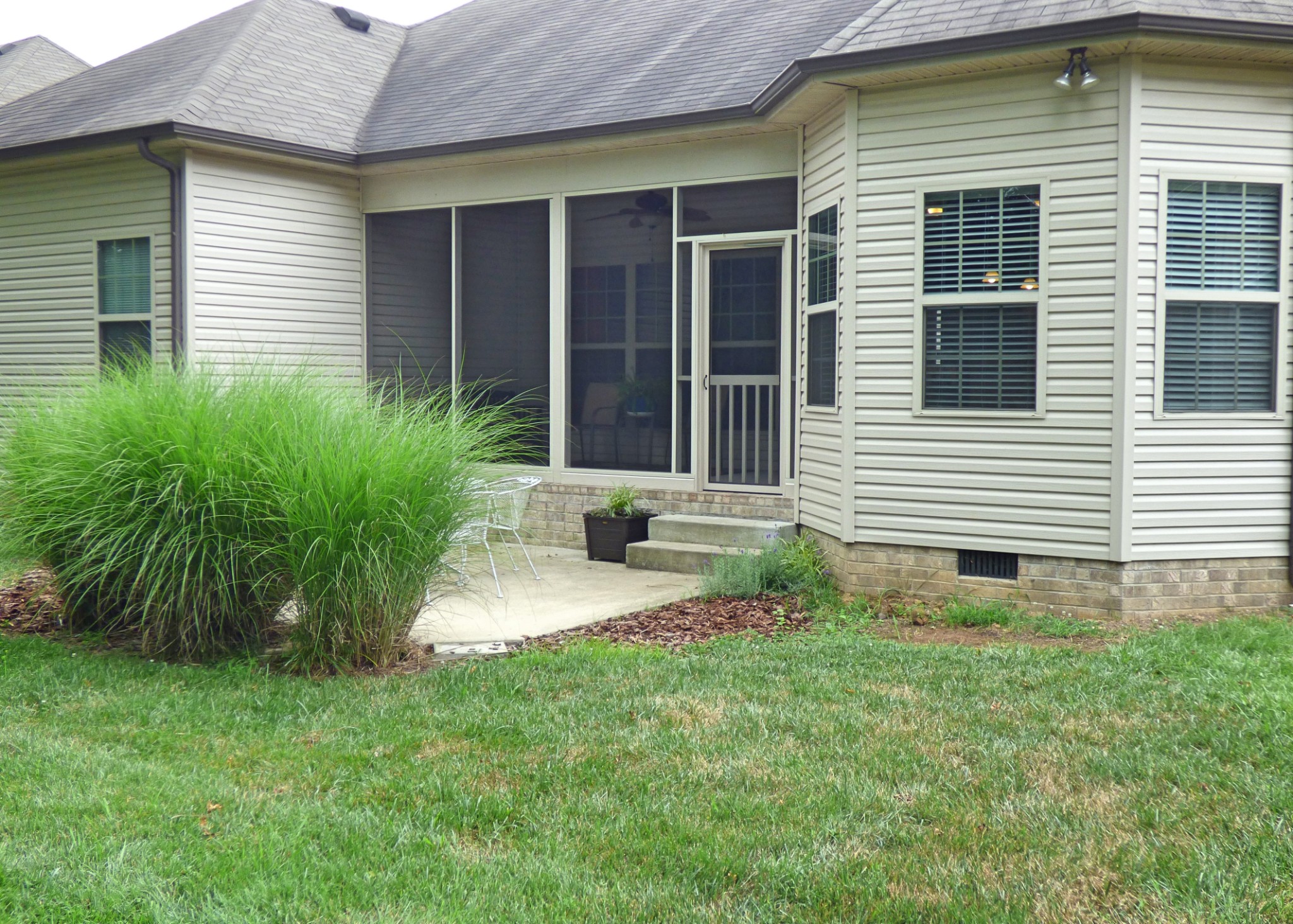 1076 Golf View Way Spring Hill, TN 37174 - Photo 18 of 19 a front view of a house with garden