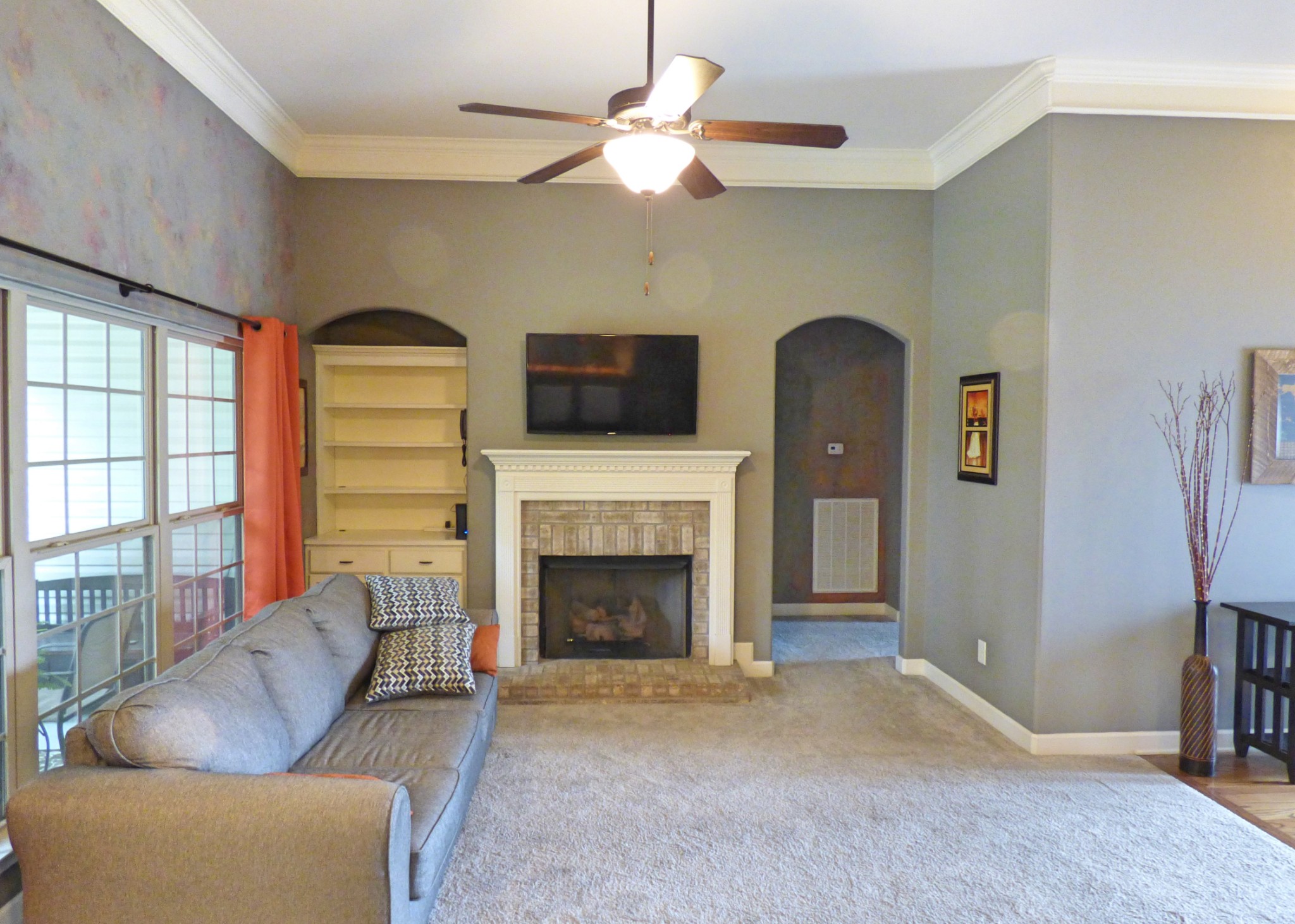 1076 Golf View Way Spring Hill, TN 37174 - Photo 4 of 19 a living room with furniture a fireplace and a flat screen tv