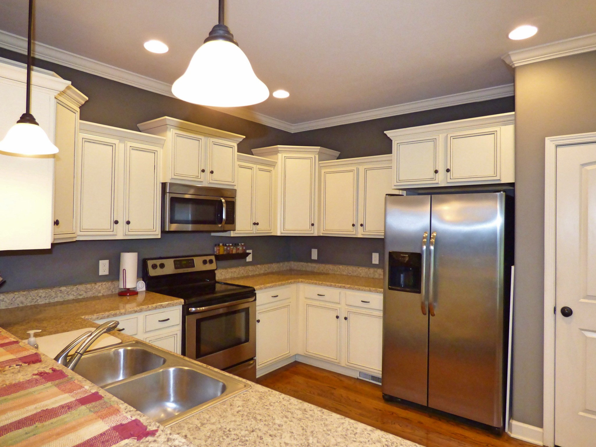 1076 Golf View Way Spring Hill, TN 37174 - Photo 6 of 19 a kitchen with stainless steel appliances granite countertop a refrigerator sink and stove