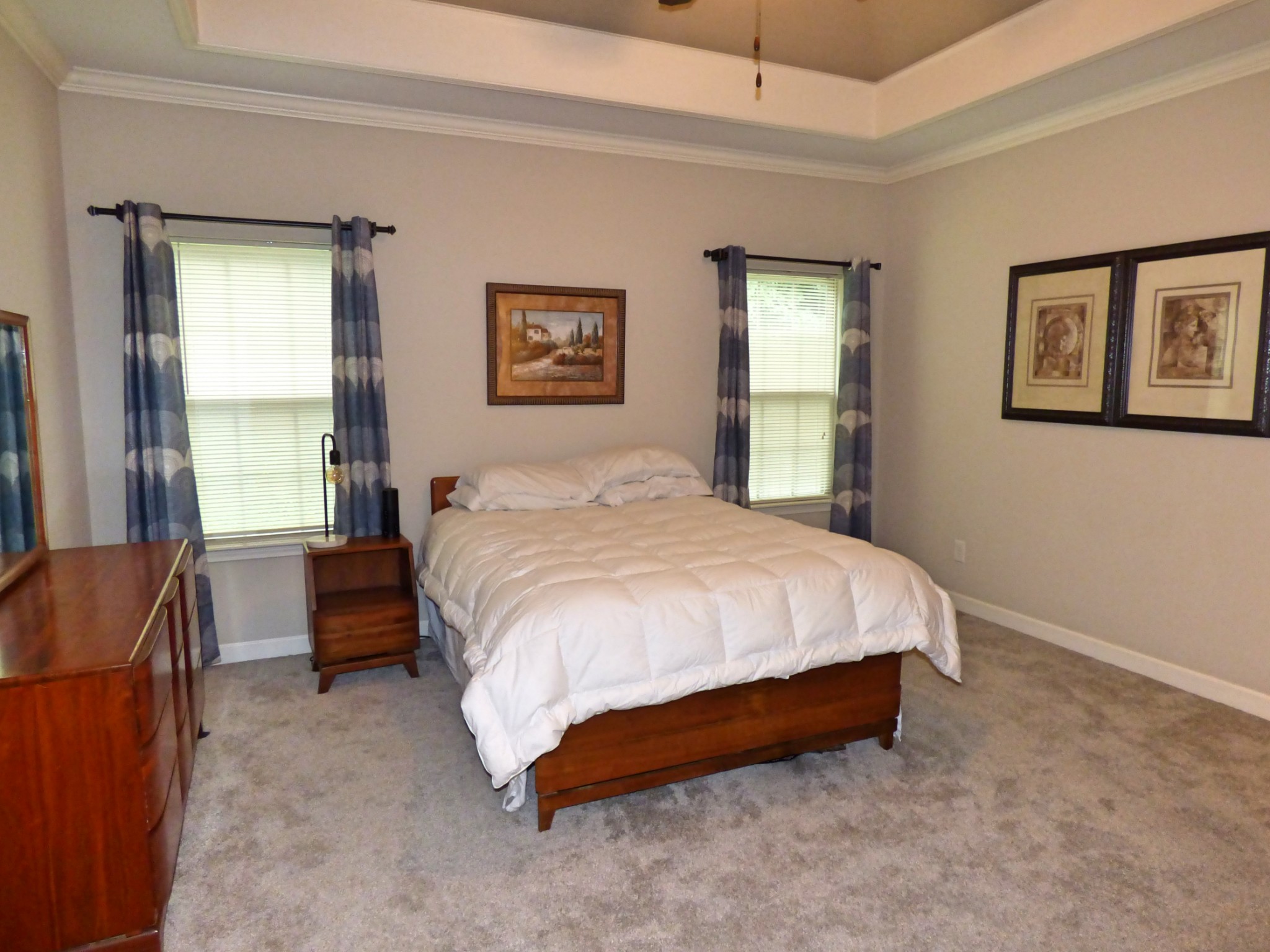 1076 Golf View Way Spring Hill, TN 37174 - Photo 8 of 19 a spacious bedroom with a bed and a couch