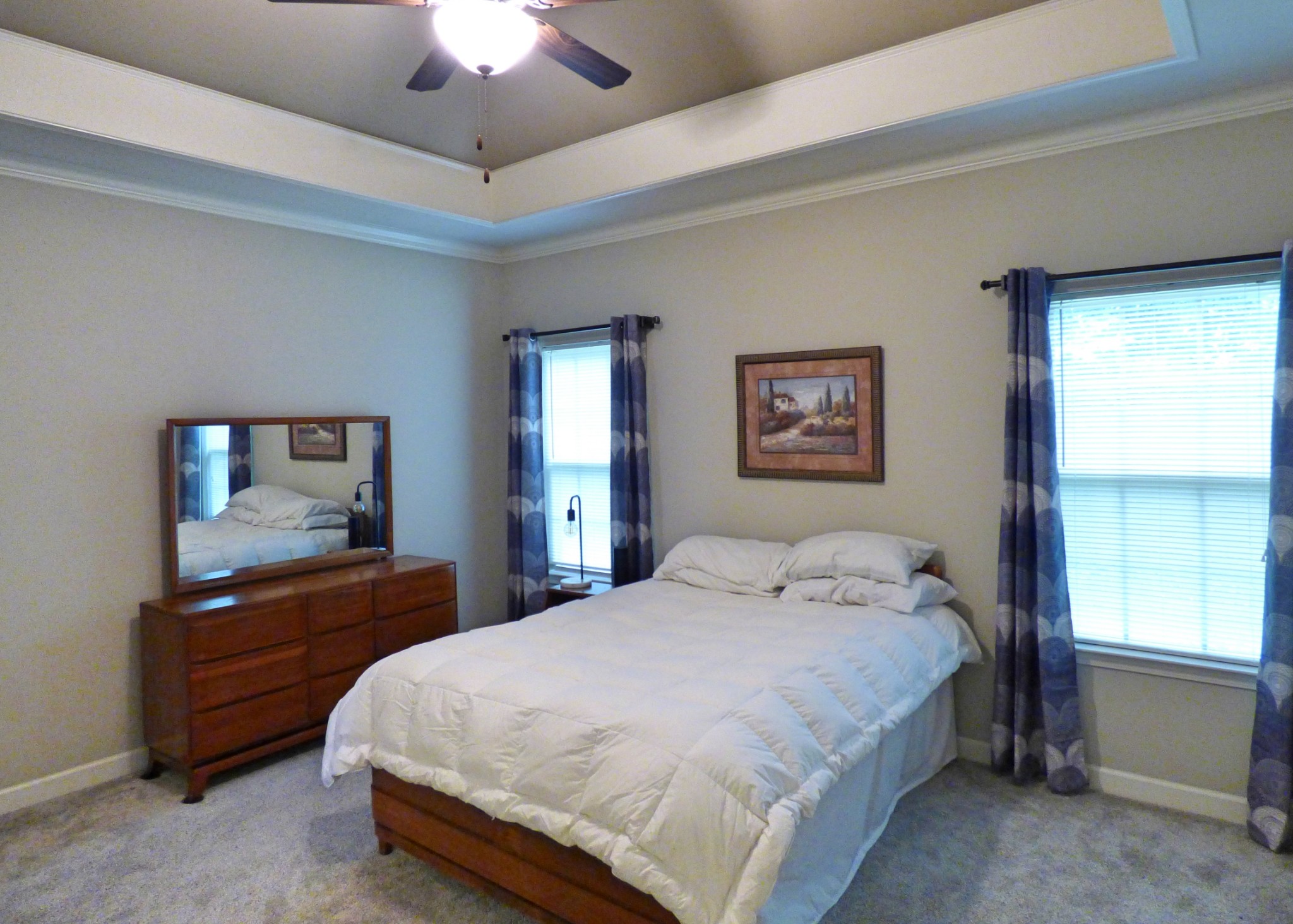 1076 Golf View Way Spring Hill, TN 37174 - Photo 9 of 19 a bedroom with a bed and a chandelier