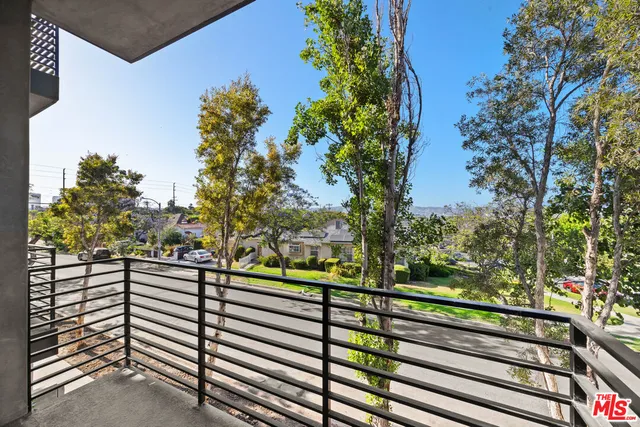 a view of a balcony with an outdoor space
