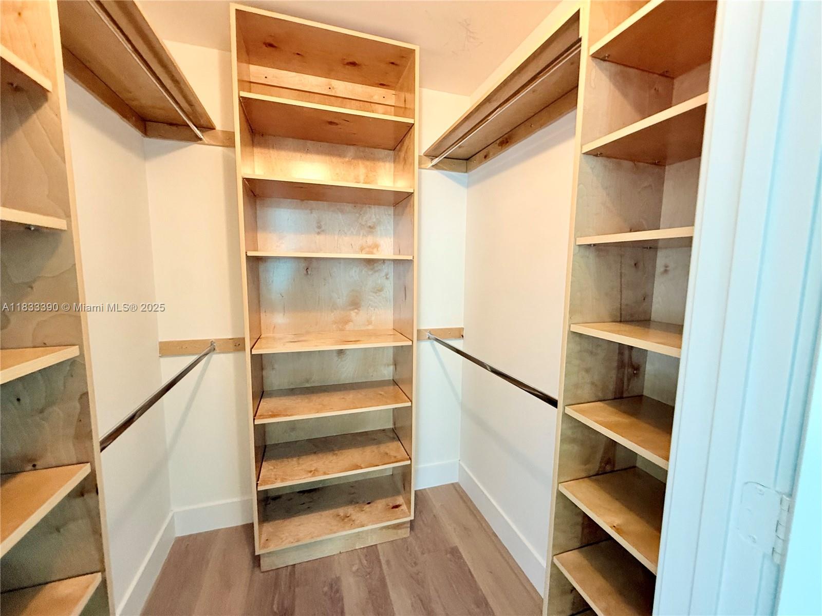 Brickell Miami, FL 33130 - Photo 11 of 15 a view of walk in closet with empty racks