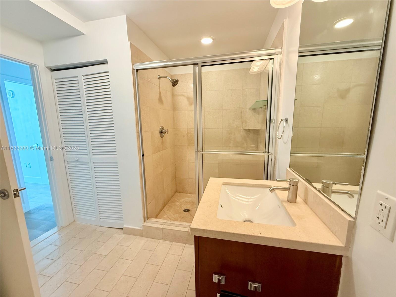 Brickell Miami, FL 33130 - Photo 5 of 15 a bathroom with a sink a toilet and shower