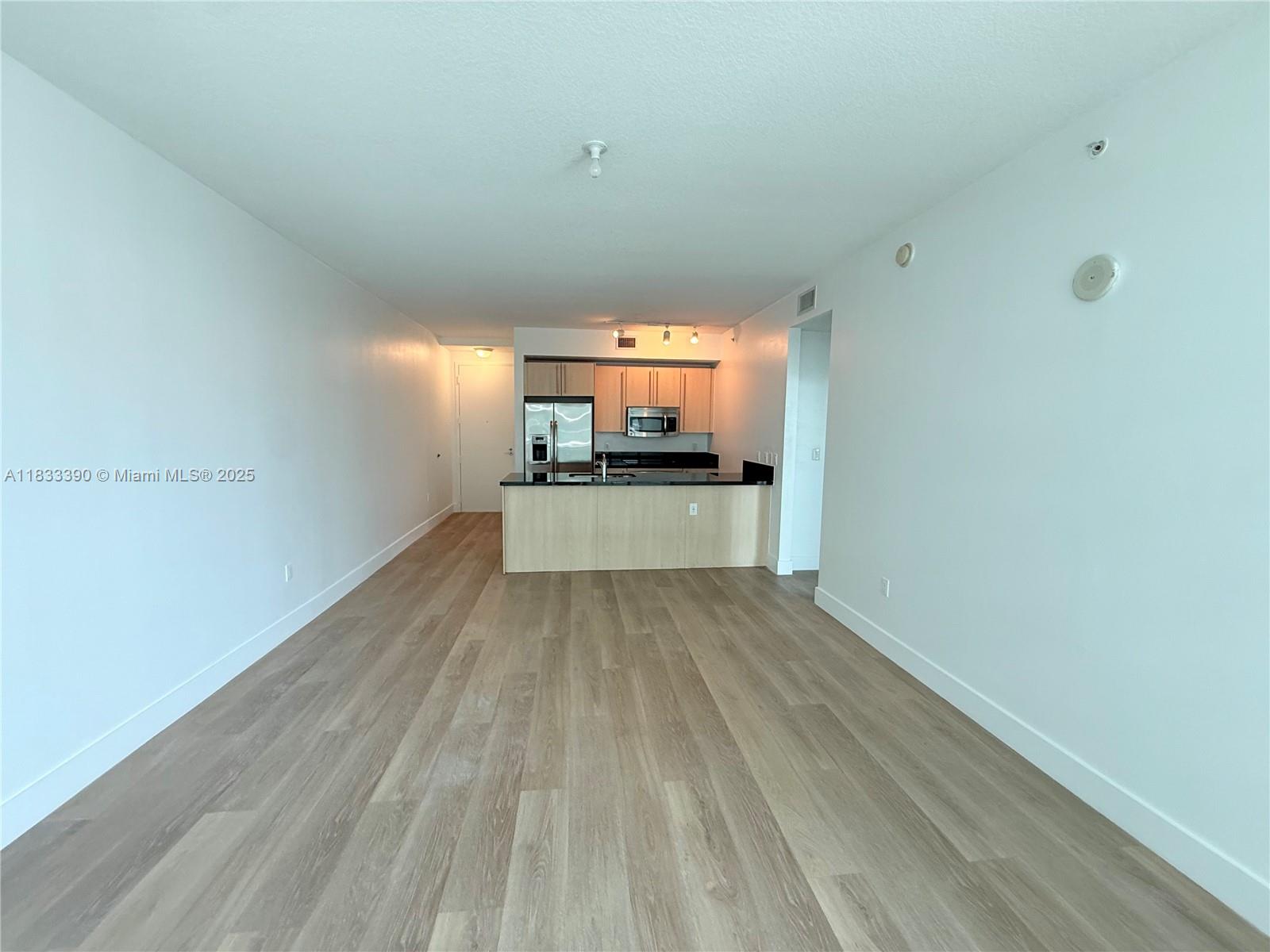 Brickell Miami, FL 33130 - Photo 7 of 15 a view of a room with wooden floor