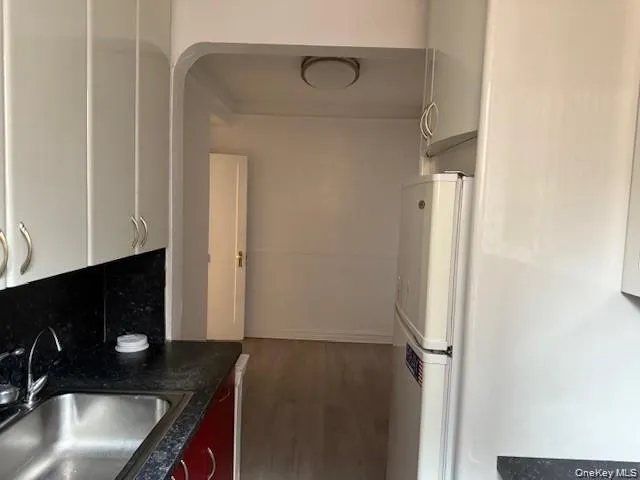 a kitchen with a sink and refrigerator