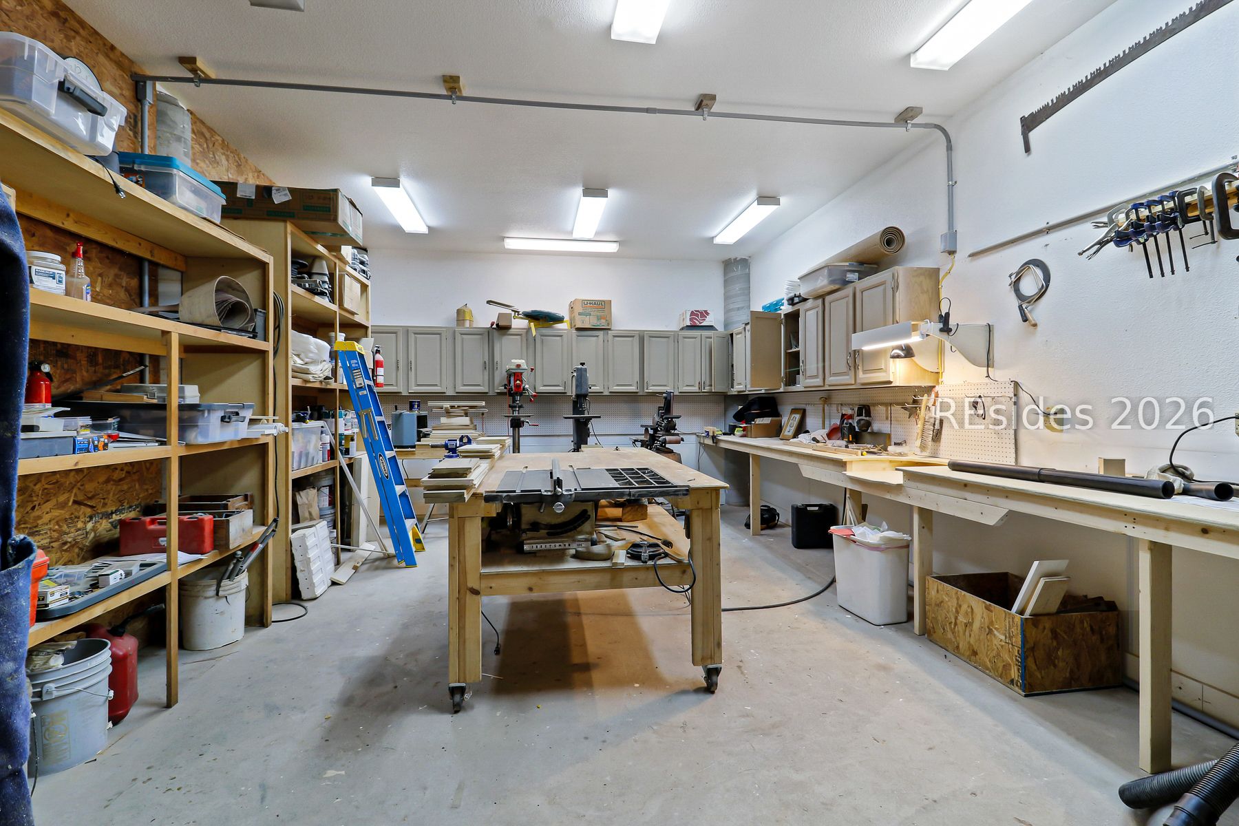 347 Broadview Drive Ridgeland, SC 29936 - Photo 93 of 100 Workshop with full Cabinetry/tables/shelves