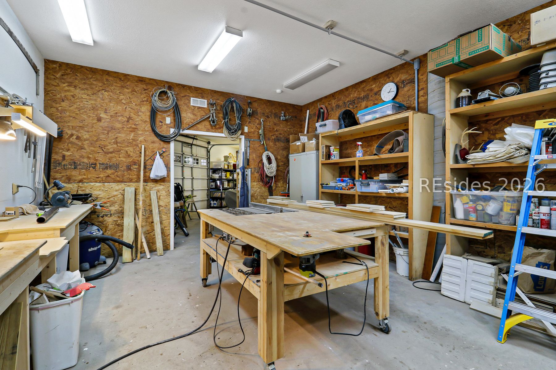 347 Broadview Drive Ridgeland, SC 29936 - Photo 94 of 100 Workshop with full Cabinetry/tables/shelves