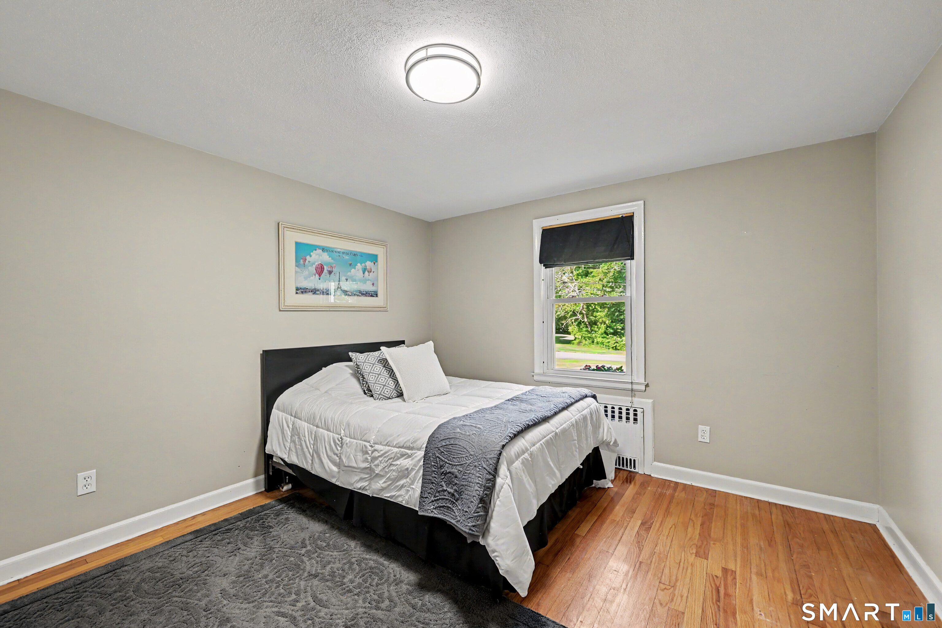 524 Ferry Road Orange, CT 06477 - Photo 27 of 40 a bedroom with a bed and a window
