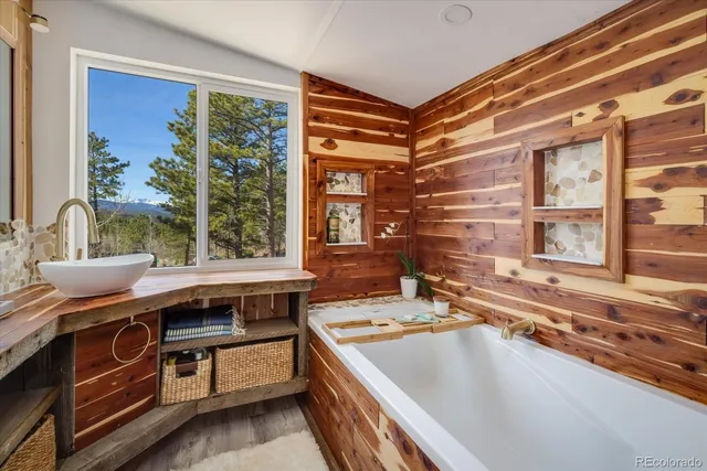 a kitchen with a stove a sink and a window